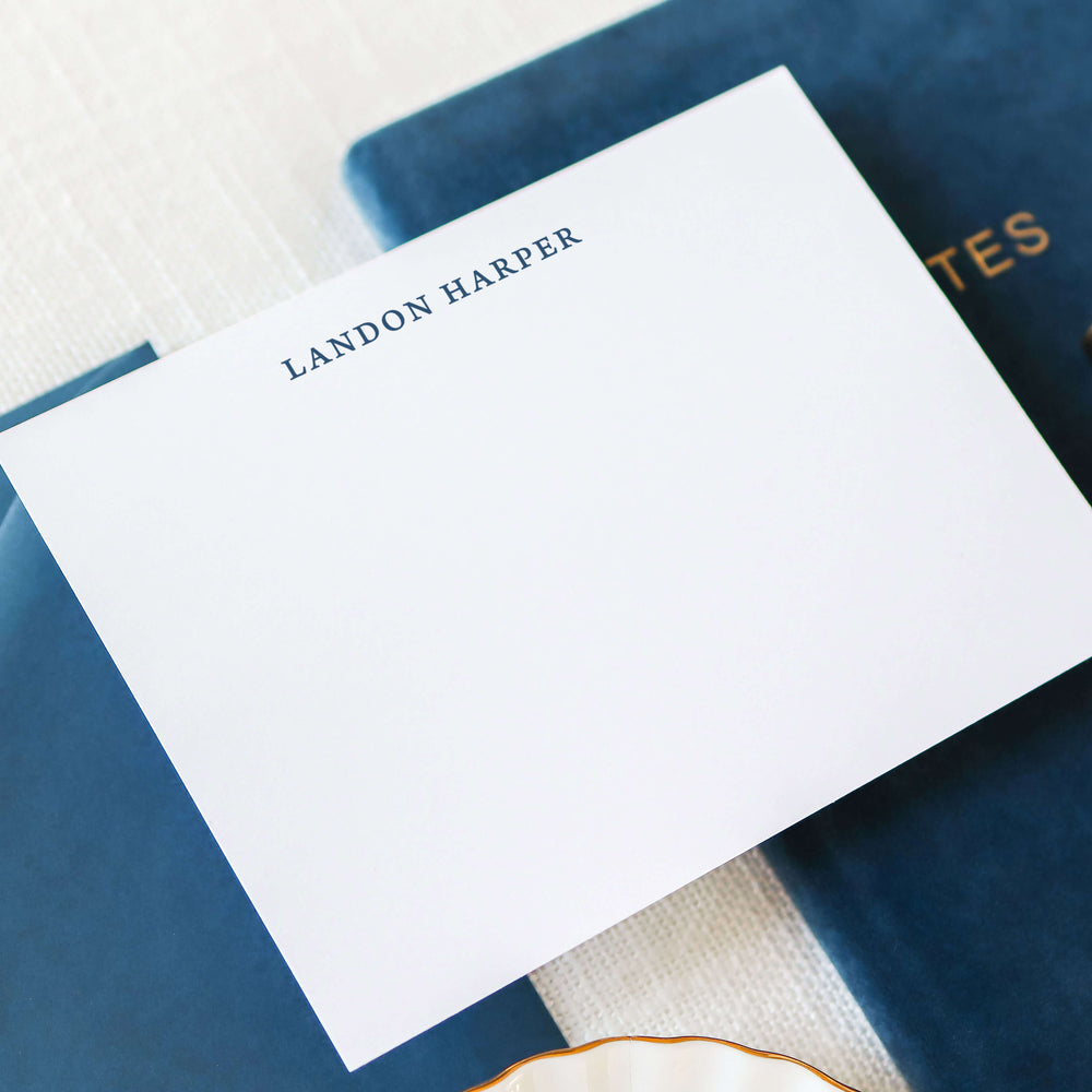 Personalized Cobalt A2 flat note card with custom name printed in navy blue letterpress on white cotton paper with matching envelope
